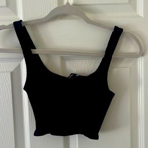 Cropped tight black ribbed tank top with scoop neck from Lulus.